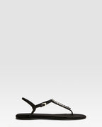 Flat sandals in black crepe satin with stud detailing