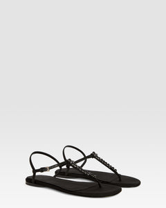 Flat sandals in black crepe satin with stud detailing