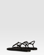 Flat sandals in black crepe satin with stud detailing
