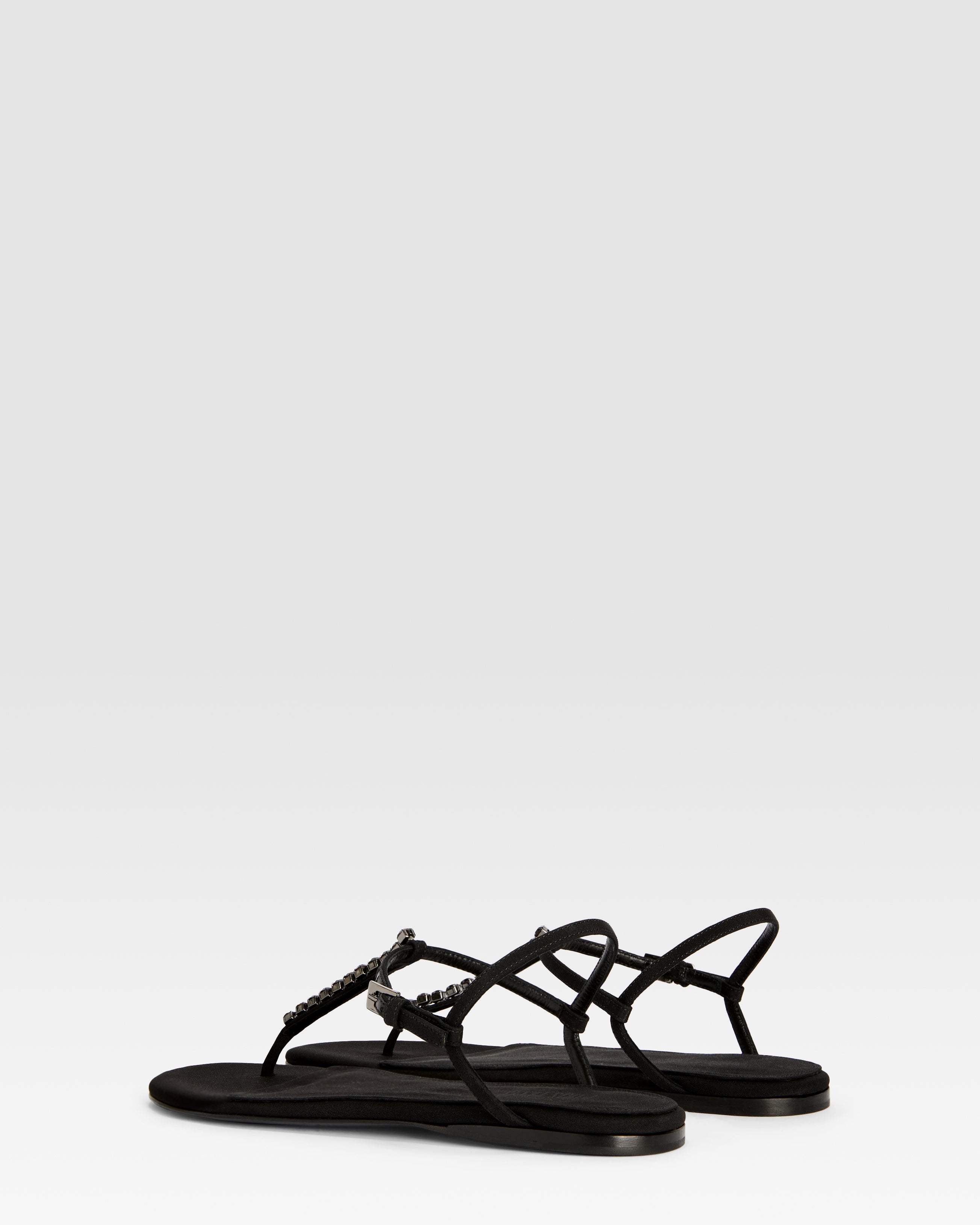 Flat sandals in black crepe satin with stud detailing