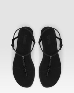 Flat sandals in black crepe satin with stud detailing