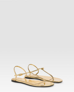 Flat sandals in gold metallic-effect, plisse leather