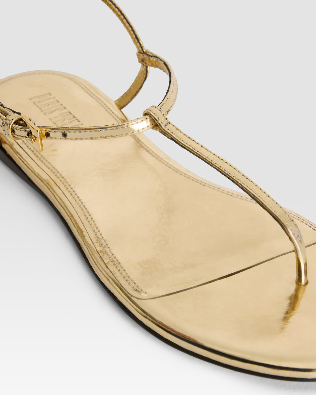 Flat sandals in gold metallic-effect, plisse leather
