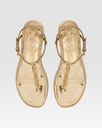Flat sandals in gold metallic-effect, plisse leather