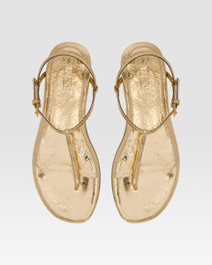Flat sandals in gold metallic-effect, plisse leather