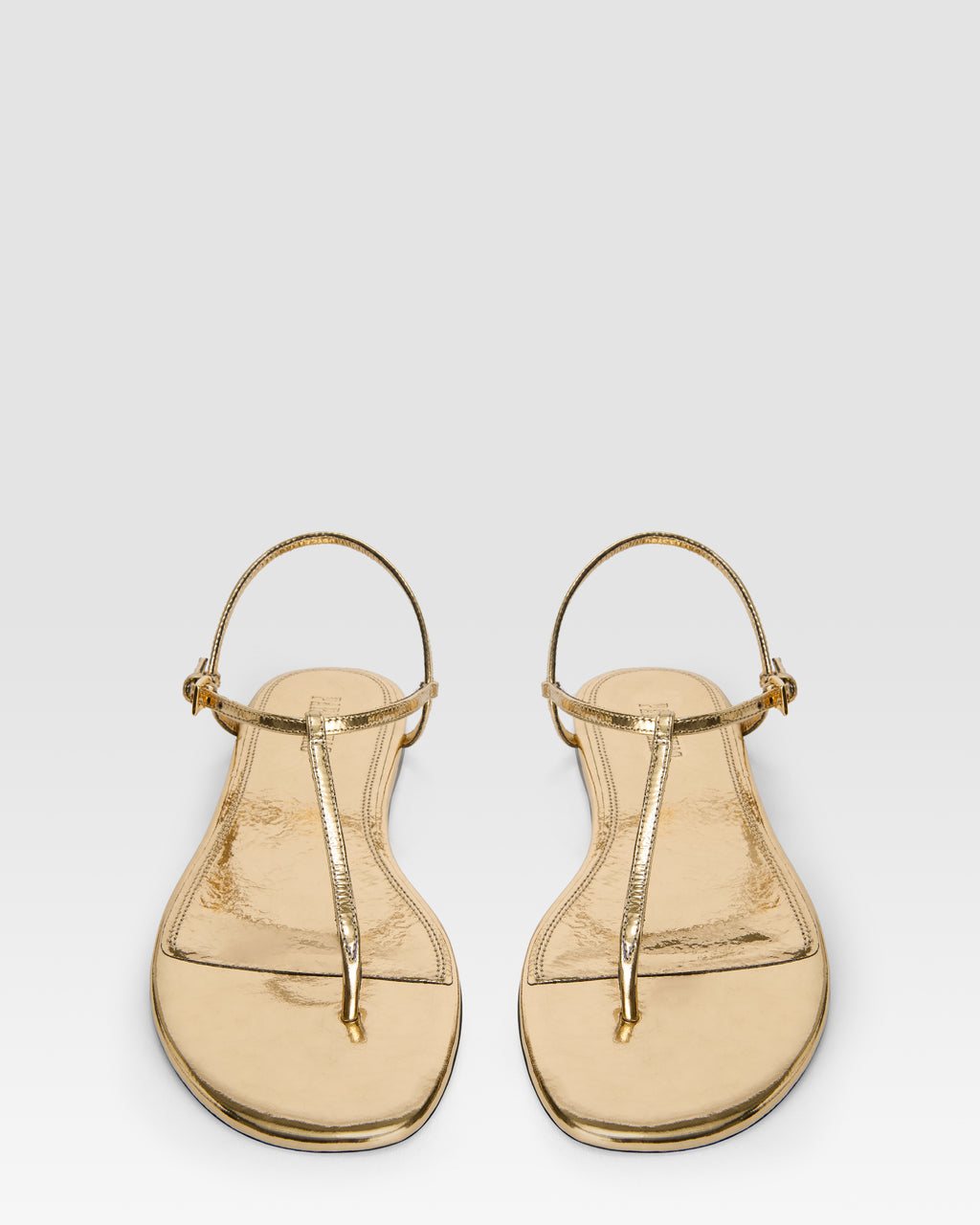 Flat sandals in gold metallic-effect, plisse leather