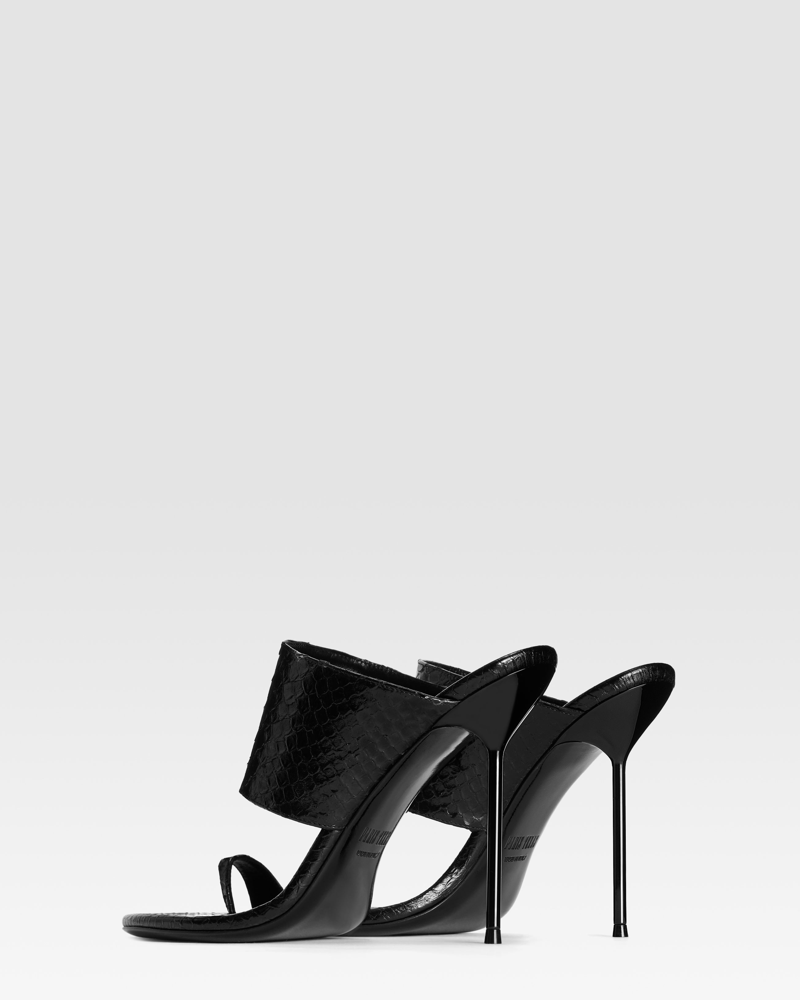 Thong-ring mules in black printed python leather