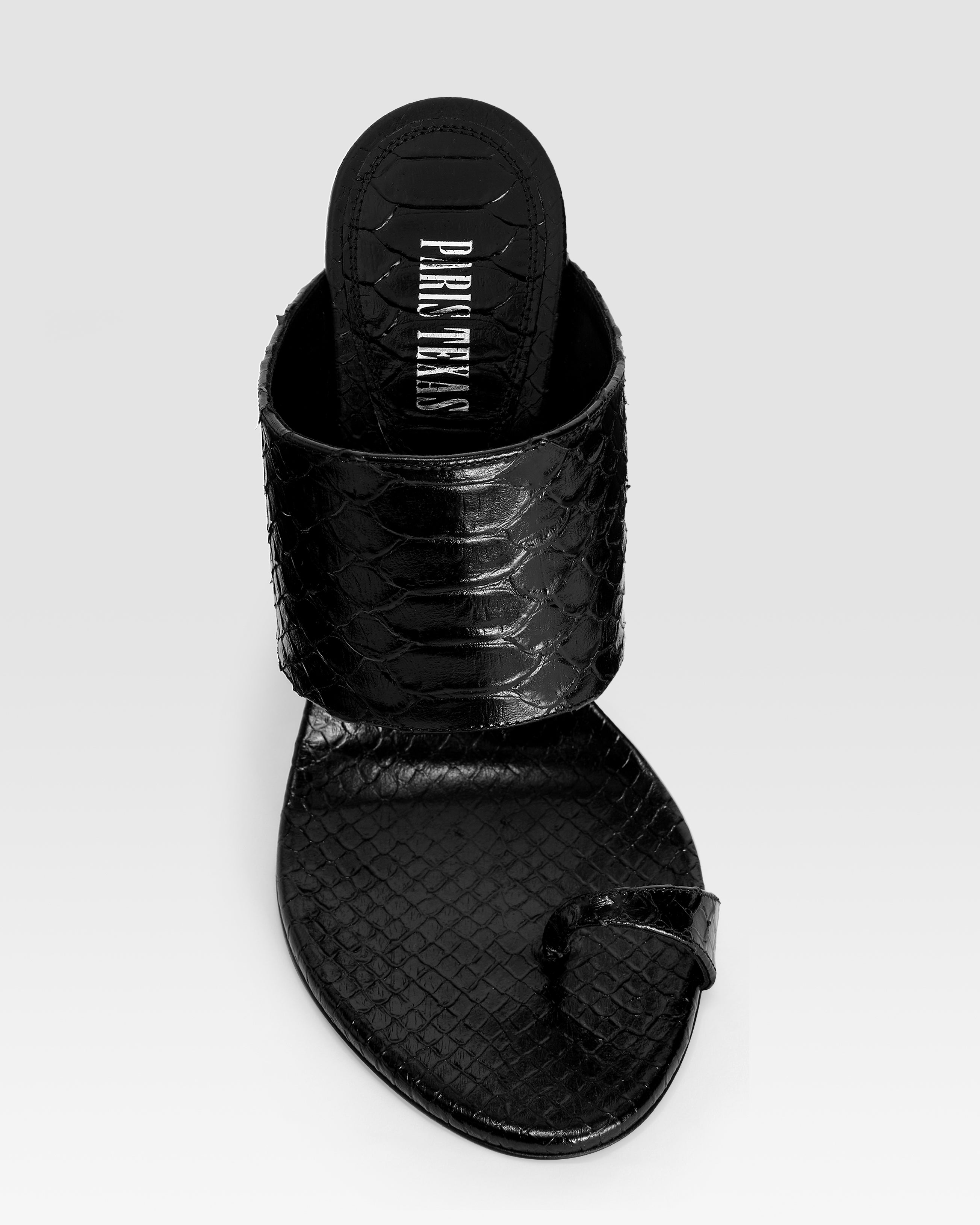 Thong-ring mules in black printed python leather