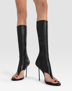 Thong boots in black stretch leather