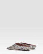 Sabots in denim-colored printed python leather