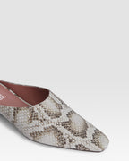 Sabots in denim-colored printed python leather