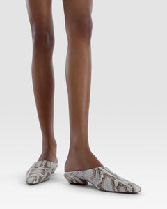 Sabots in denim-colored printed python leather