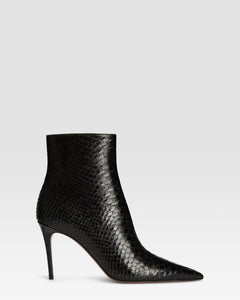 Ankle boots in black printed python leather