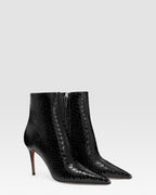 Ankle boots in black printed python leather