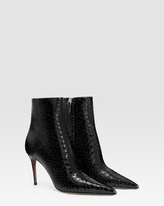 Ankle boots in black printed python leather