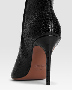 Ankle boots in black printed python leather