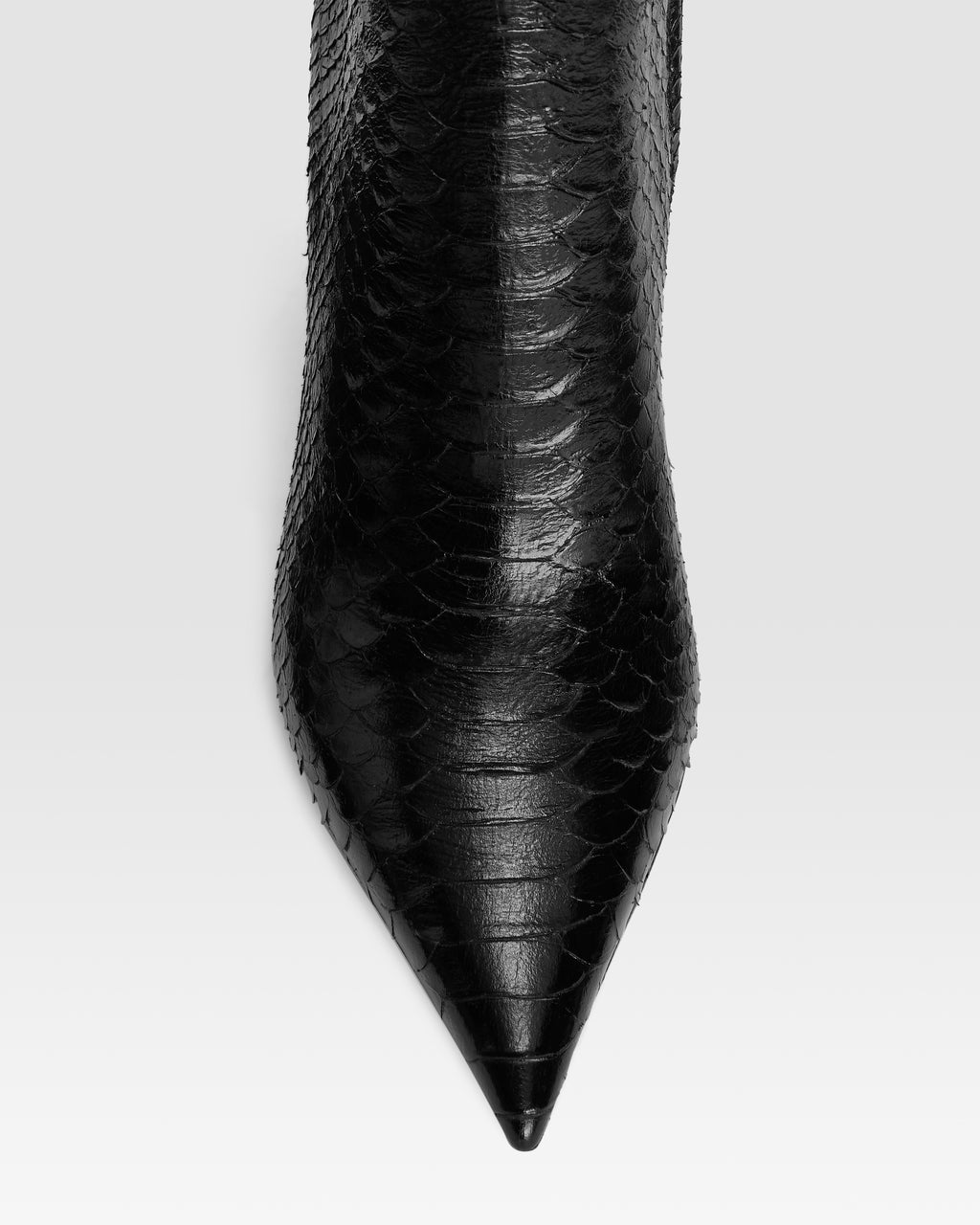 Ankle boots in black printed python leather