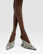 Sabots in denim-colored printed python leather