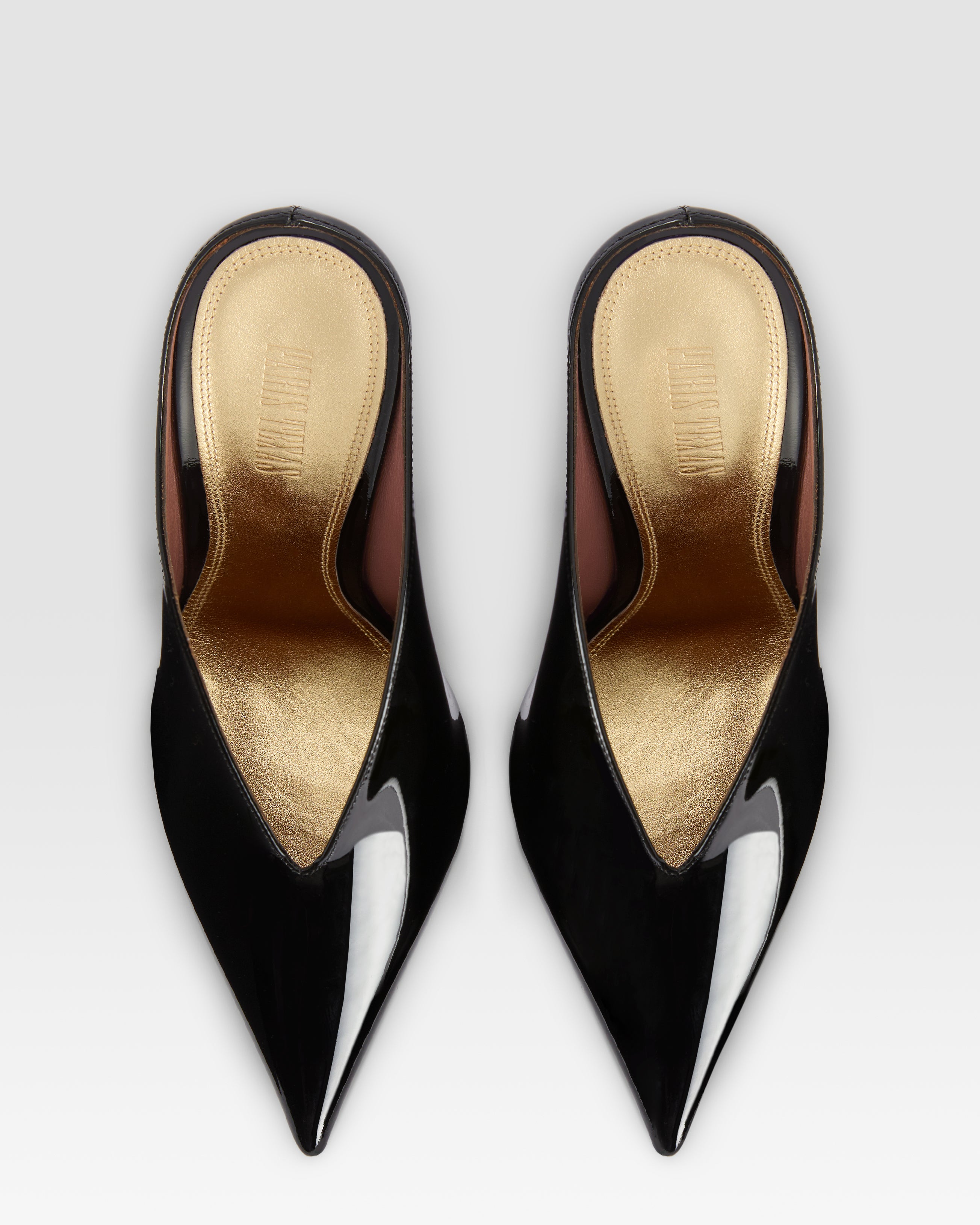 Sabots in black and gold patent leather