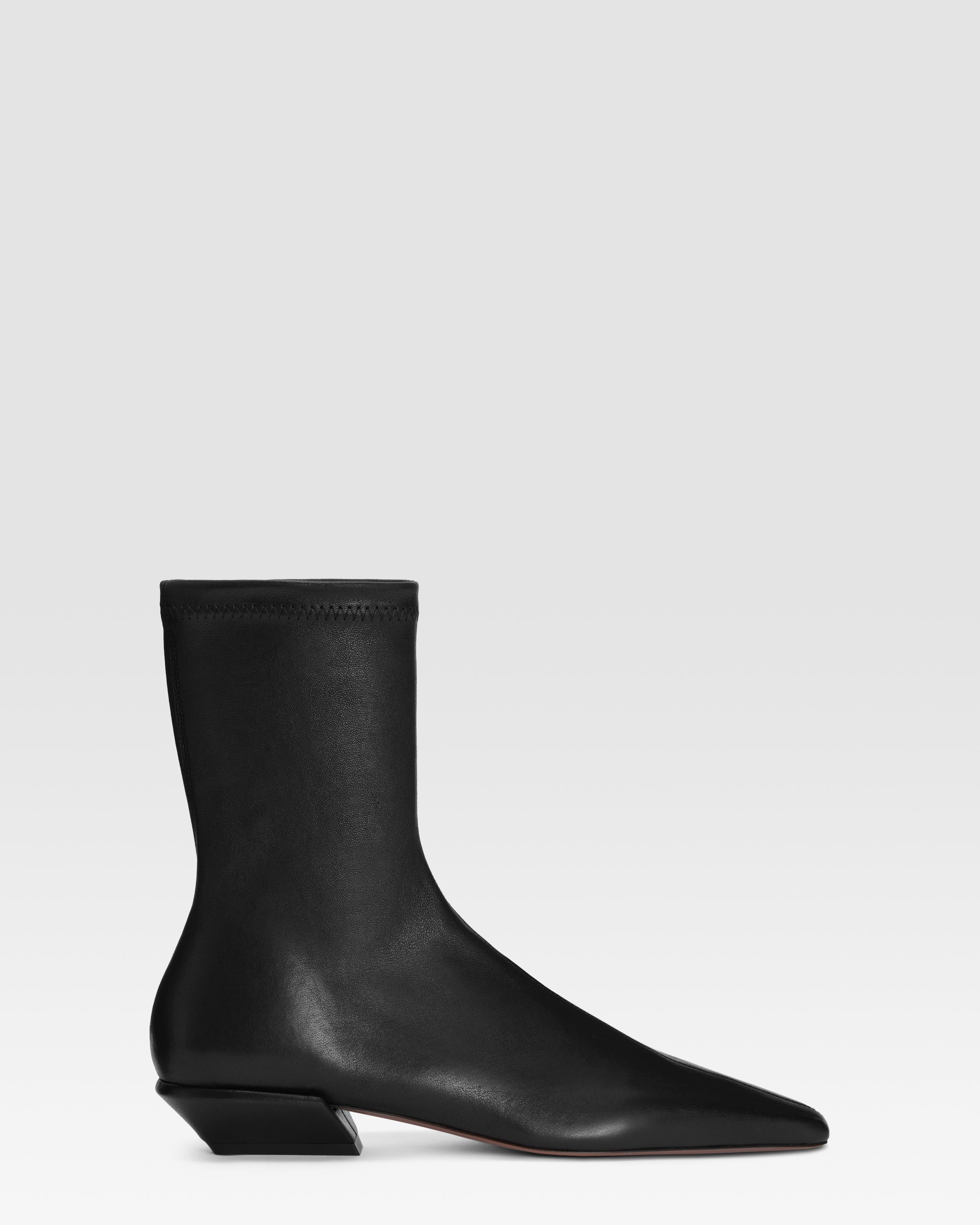 Ankle boots in black stretch leather