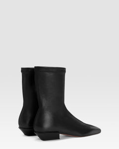 Ankle boots in black stretch leather