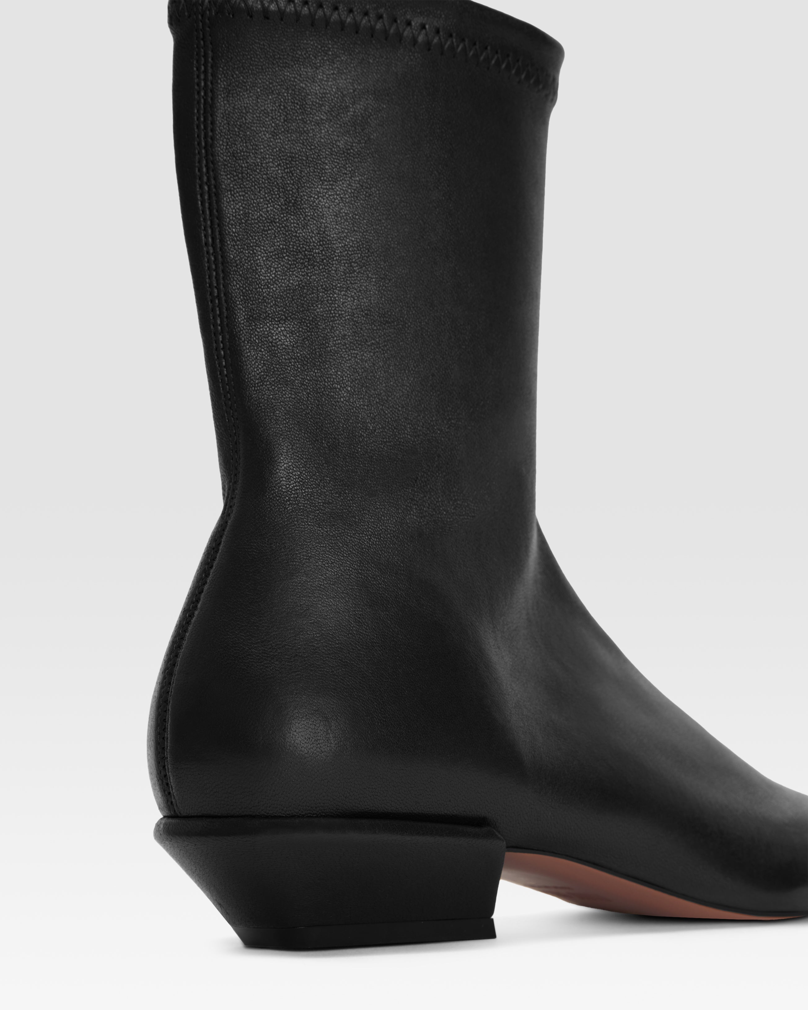 Ankle boots in black stretch leather