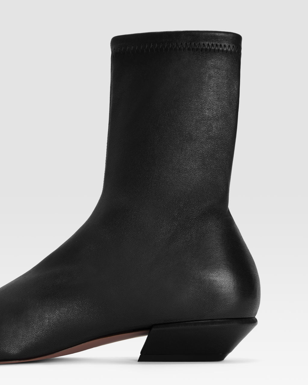 Ankle boots in black stretch leather
