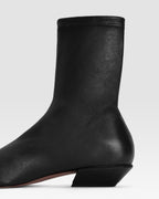 Ankle boots in black stretch leather