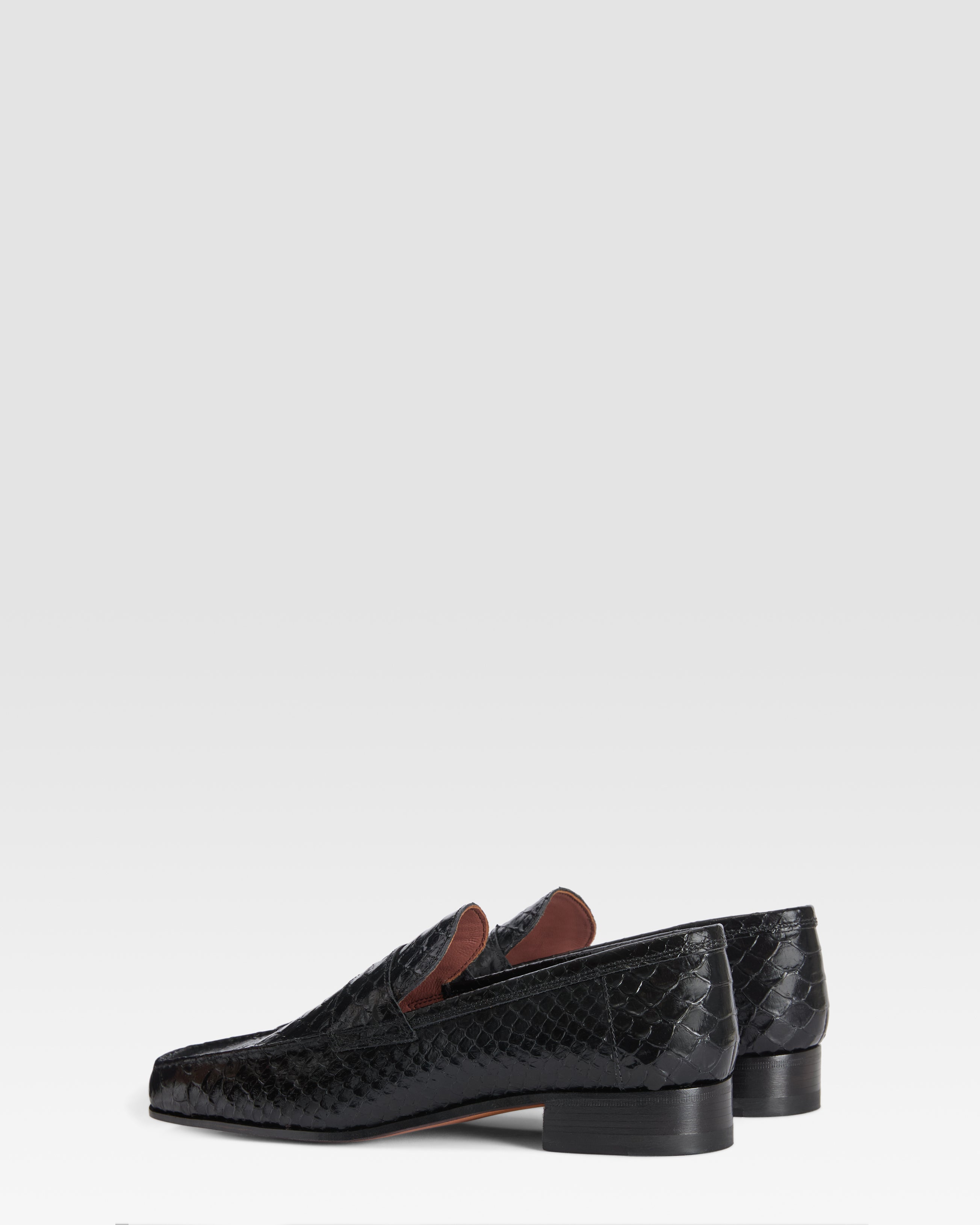 Loafers in black printed python leather