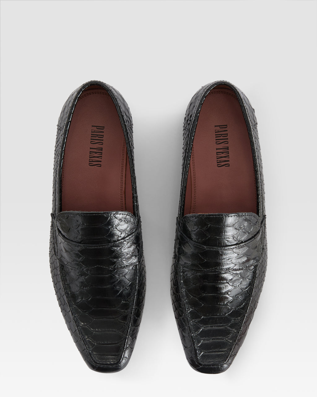 Loafers in black printed python leather