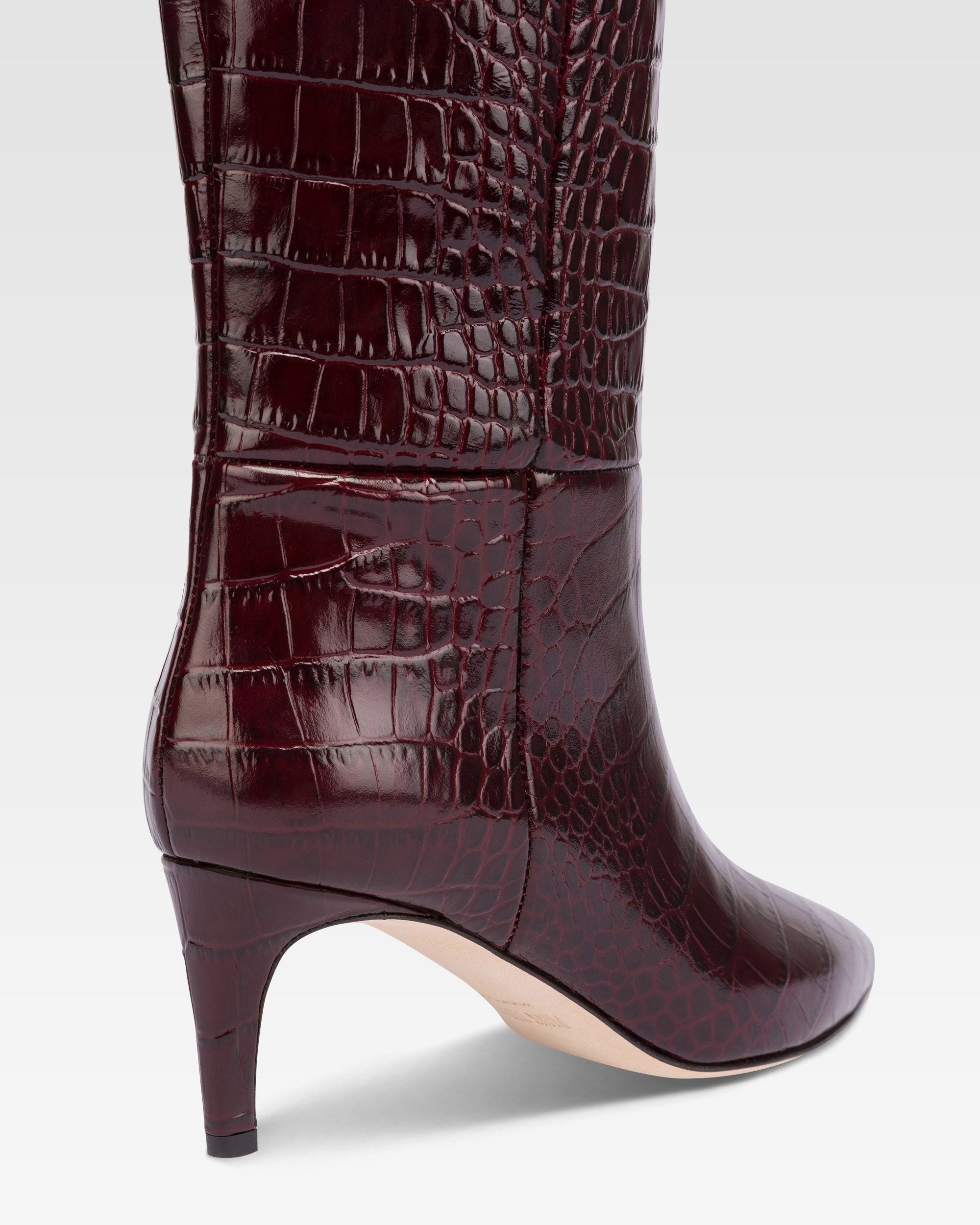 Pointed knee-high boots in rouge noir soft croco-embossed leather