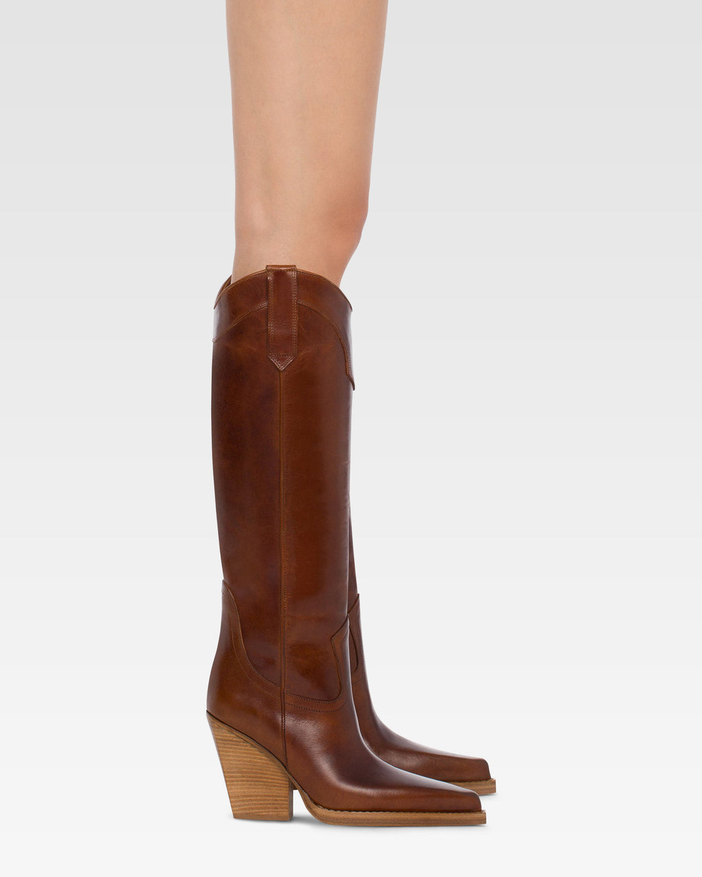 Pointed knee-high boots in shiny vintage leather