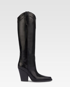 Pointed knee-high boots in black shiny vintage leather