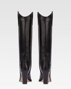 Pointed knee-high boots in black shiny vintage leather