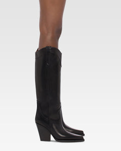 Pointed knee-high boots in black shiny vintage leather