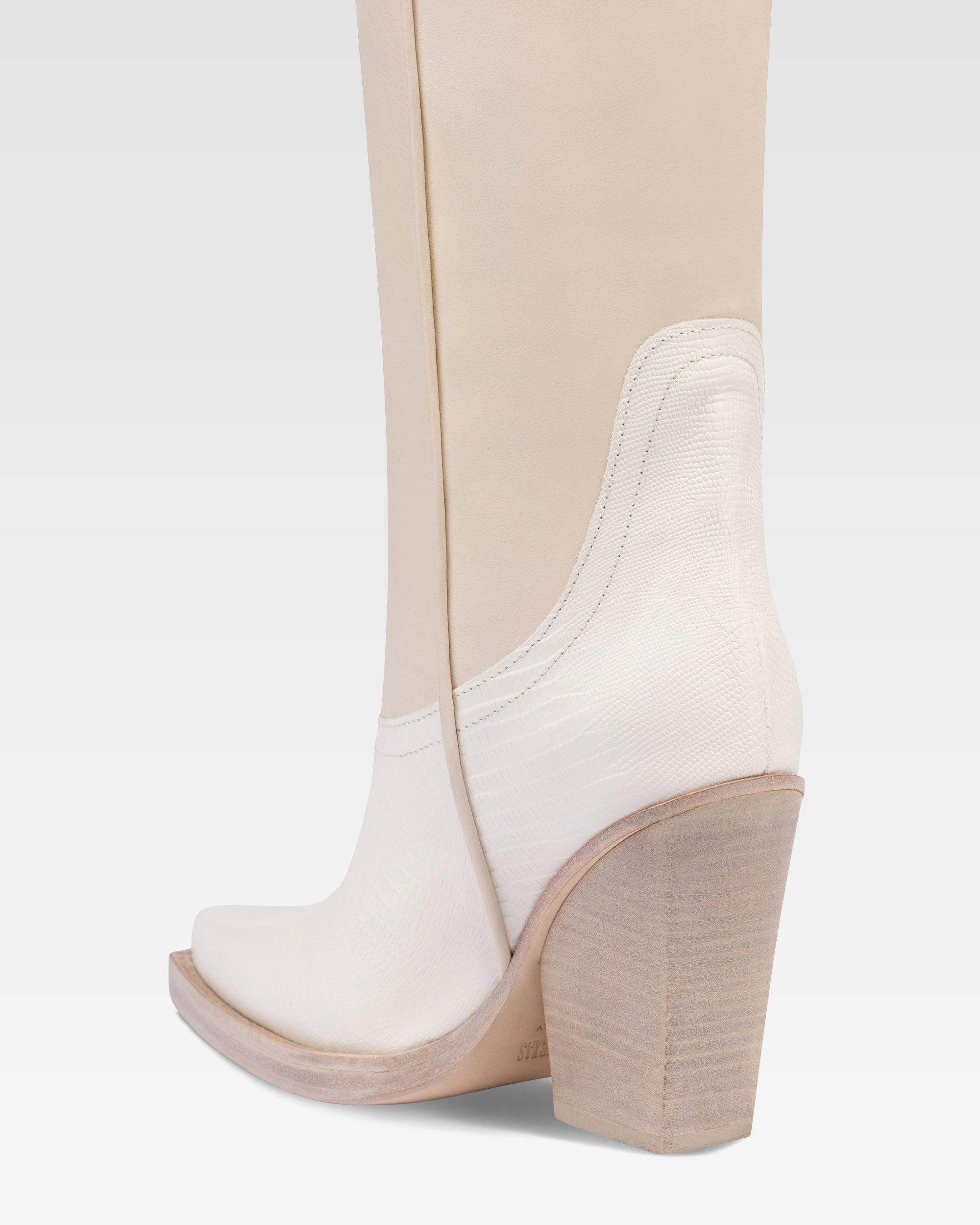 Boots in lizard-print and white leather