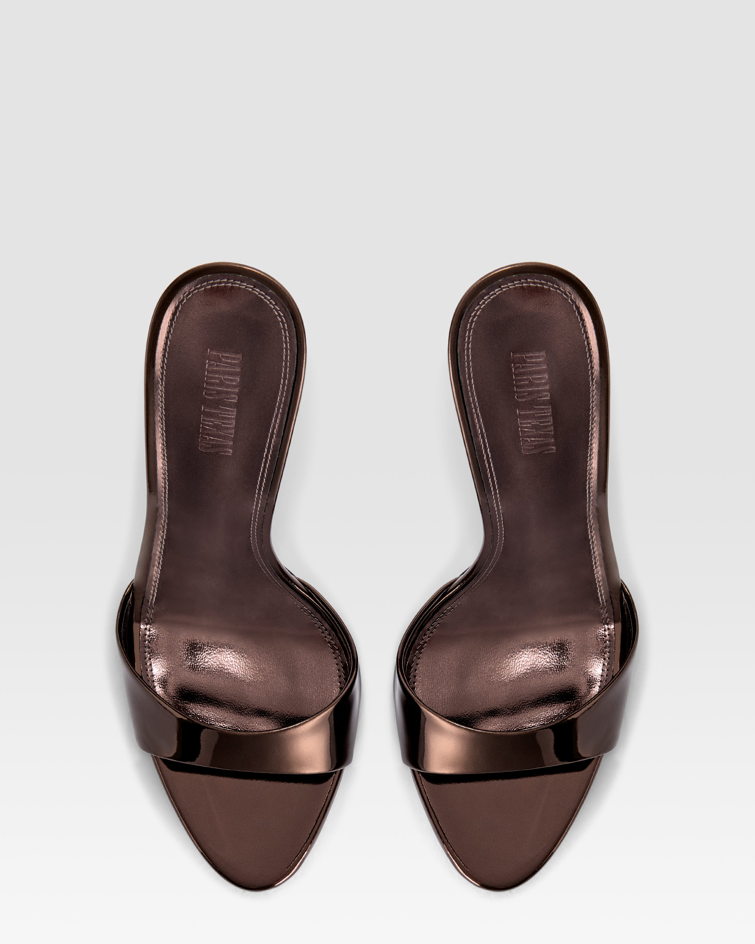 Mules in ebony, mirror-effect leather