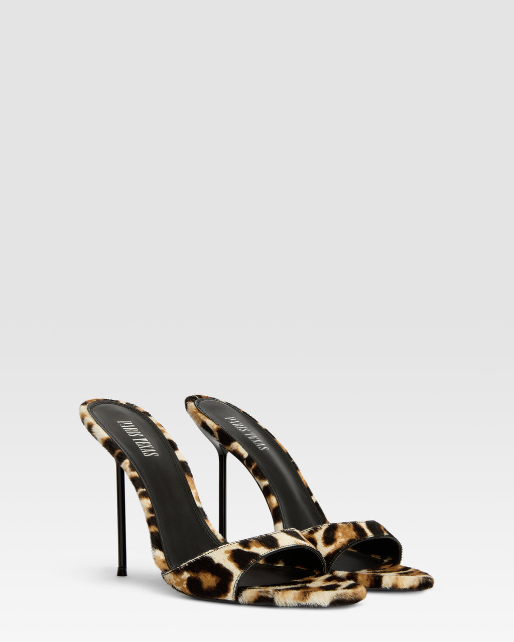Mules in white leopard print cowhide