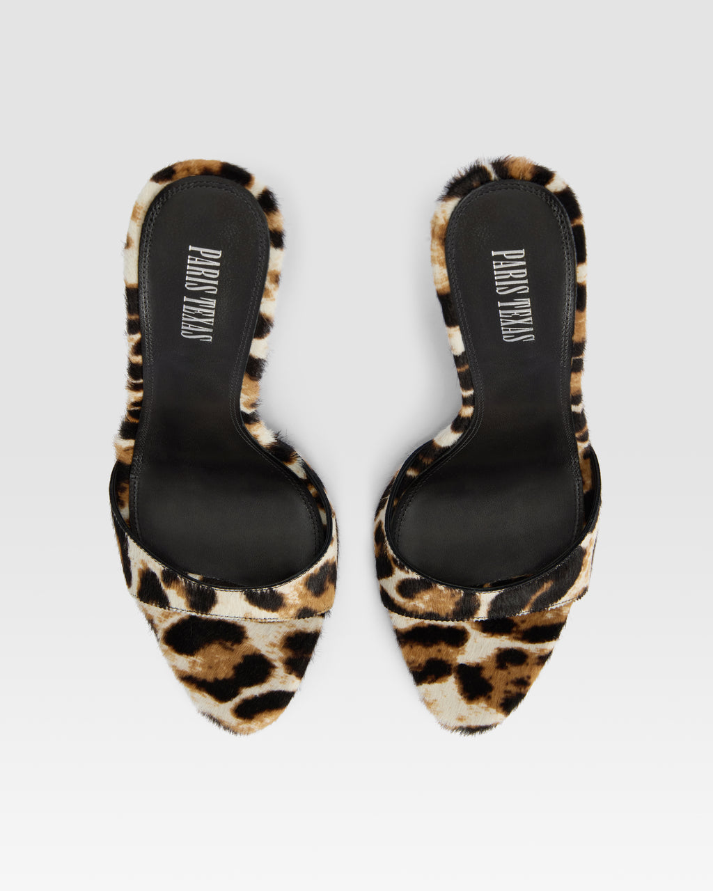 Mules in white leopard print cowhide