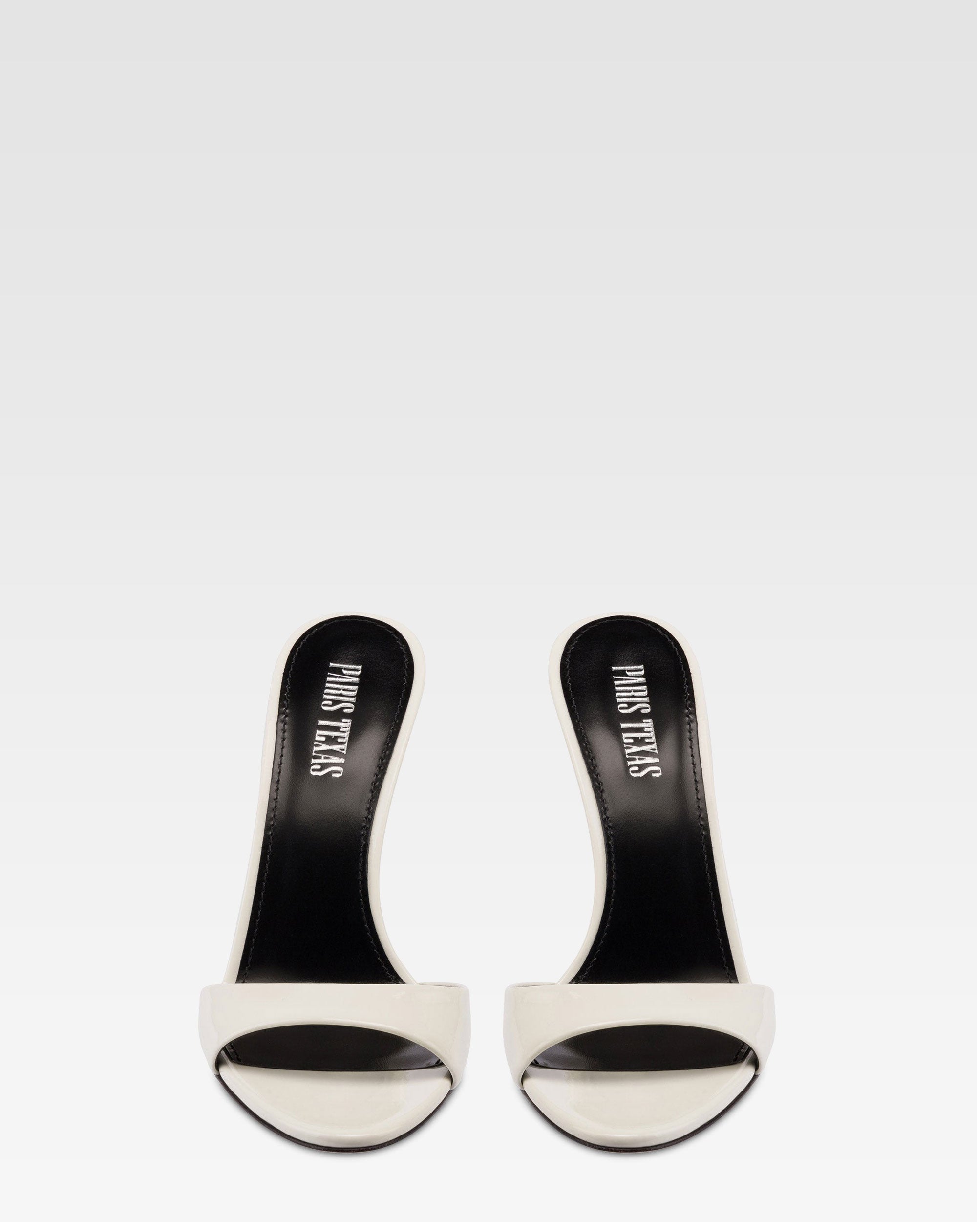 Mules in vernice bianca