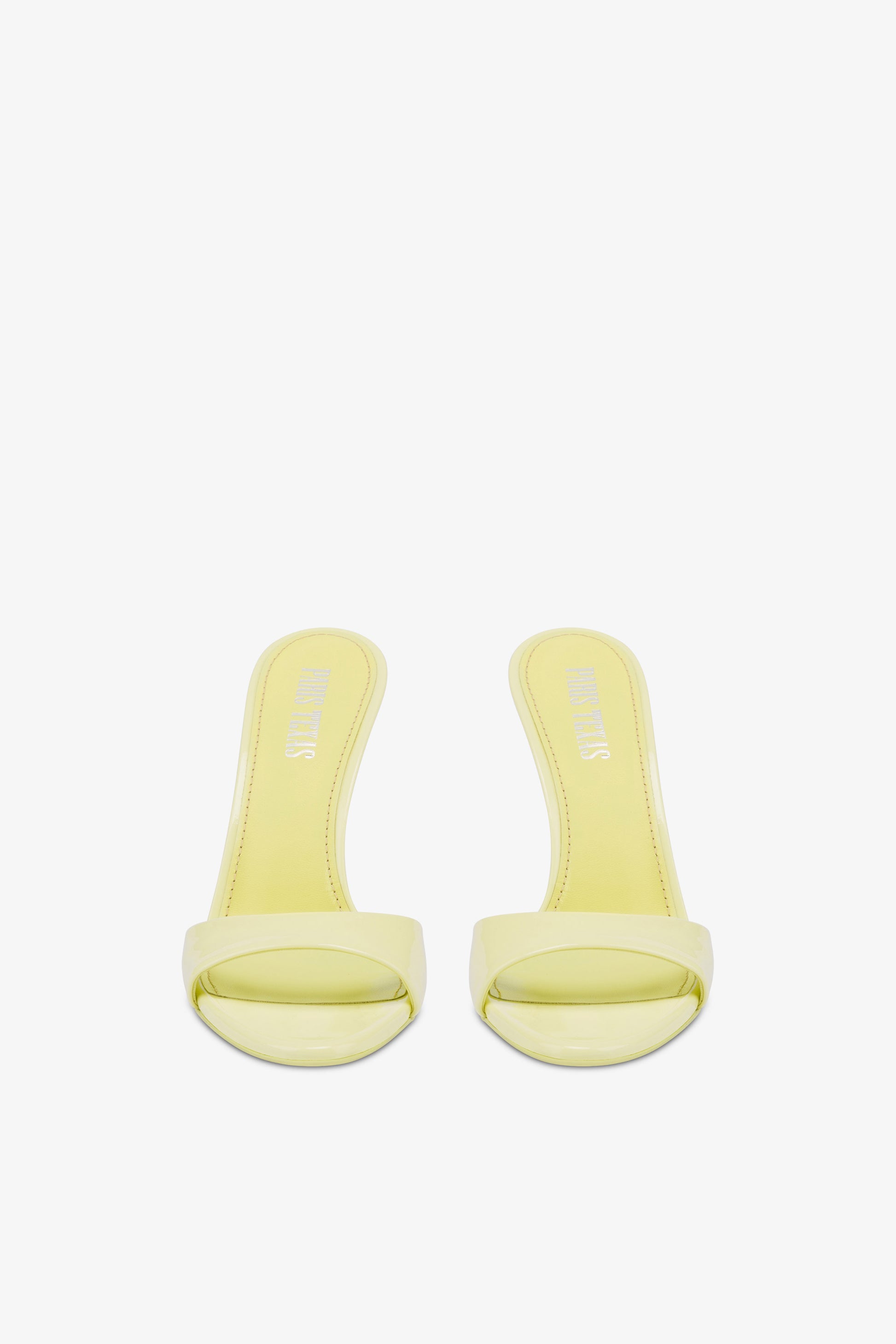 Mules in light yellow patent leather