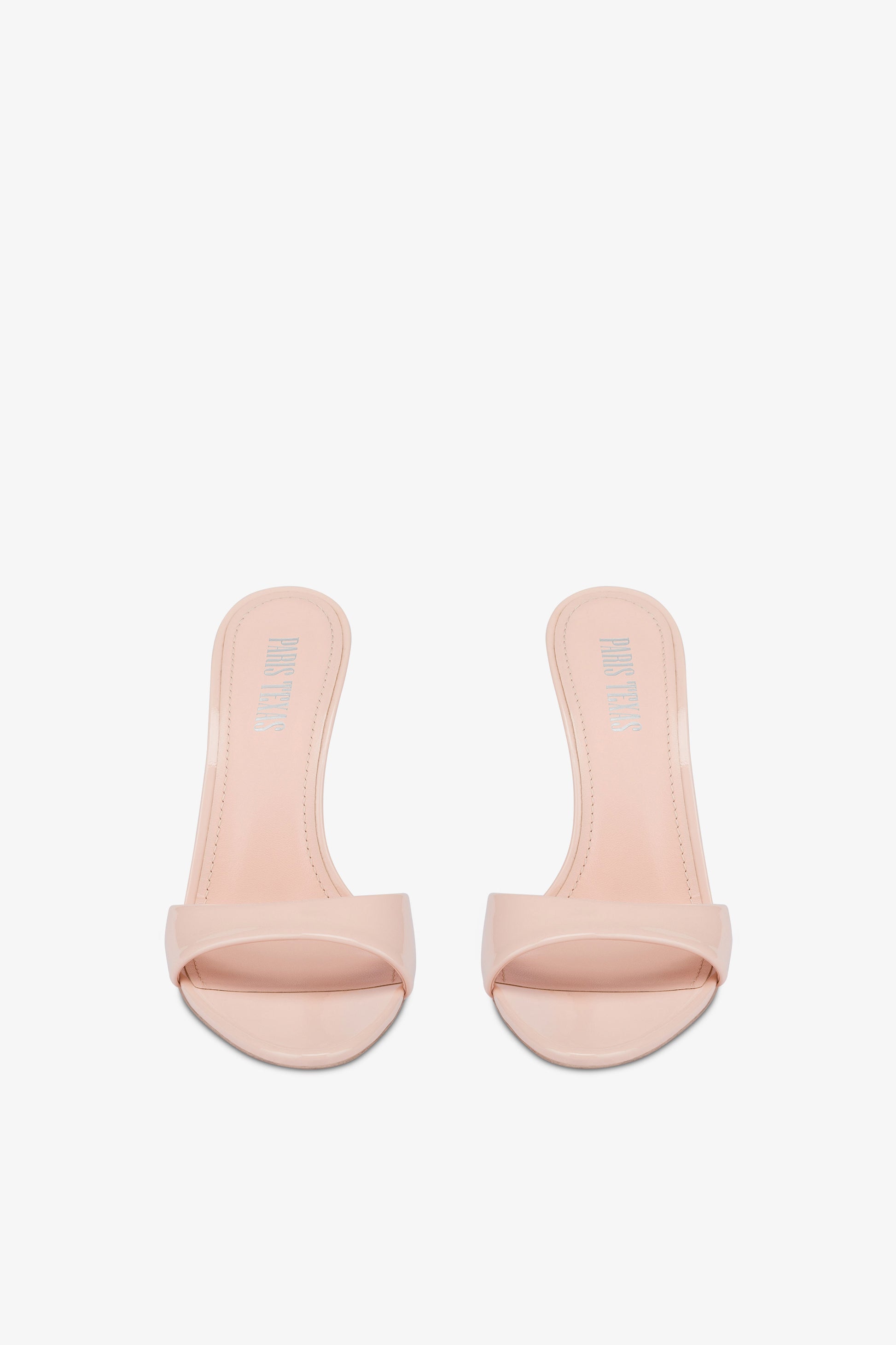 Mules in powder pink patent leather