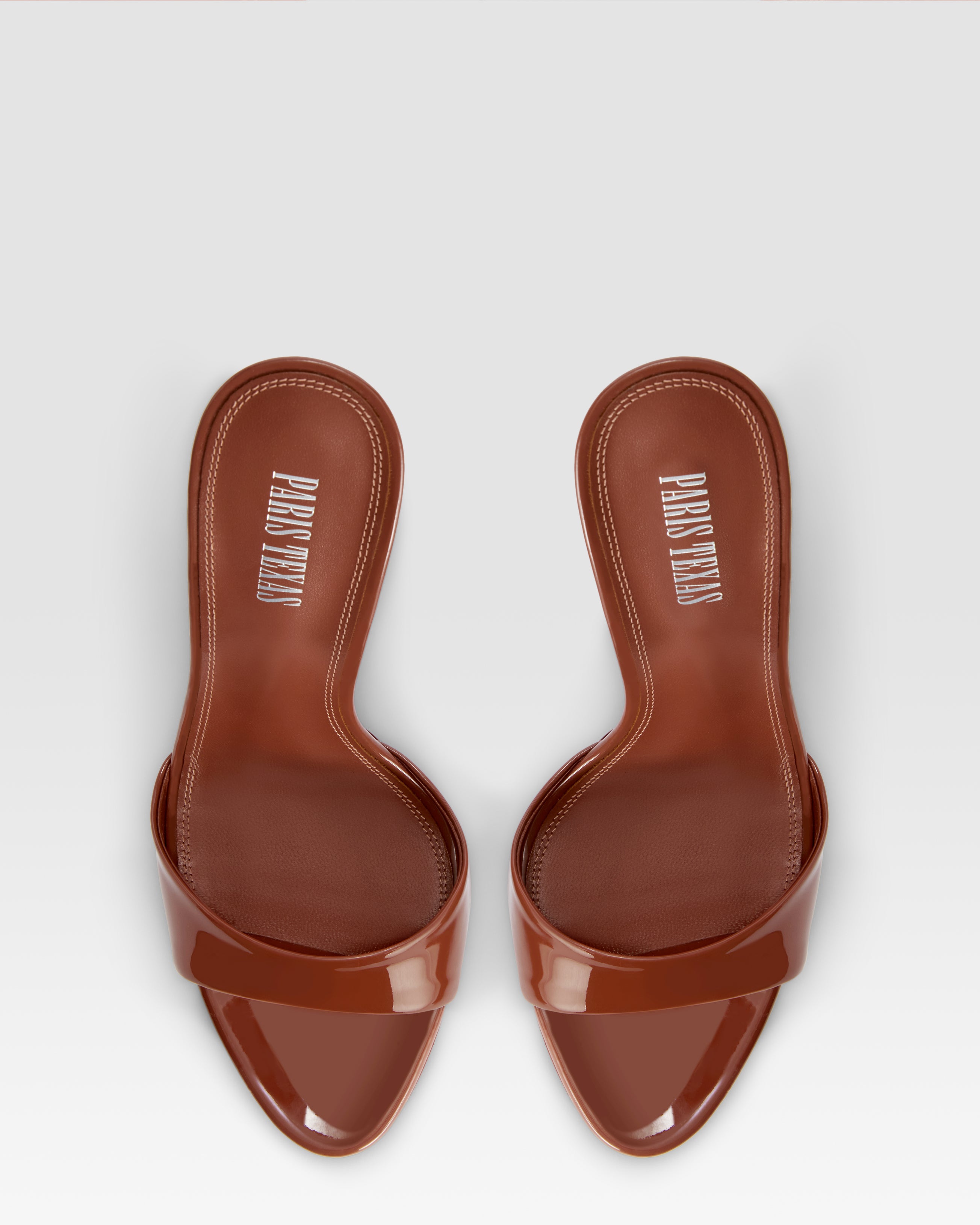 Mules in desert rose patent leather