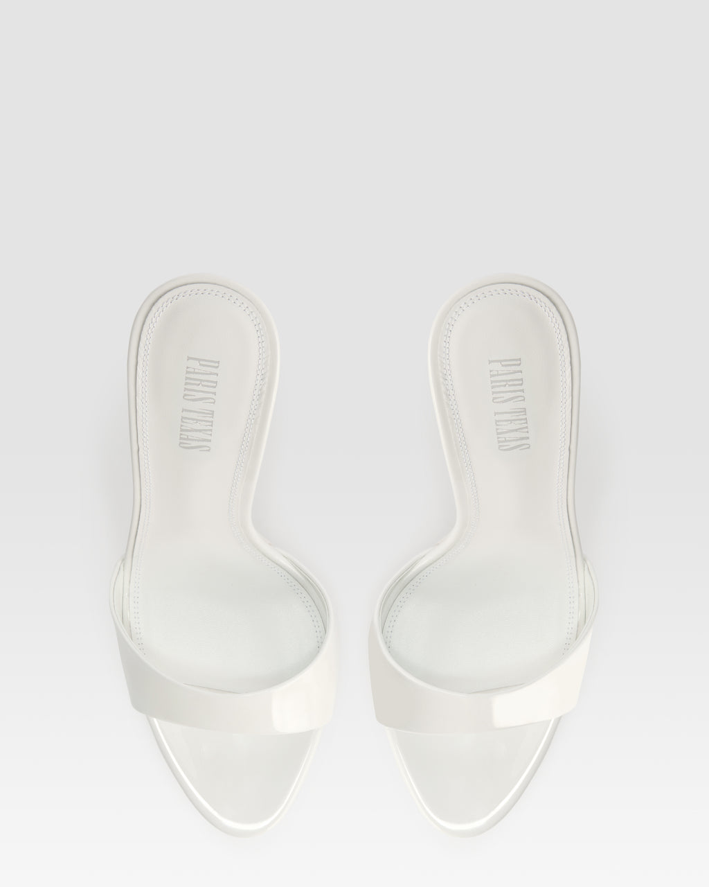 Mules in optic white patent leather