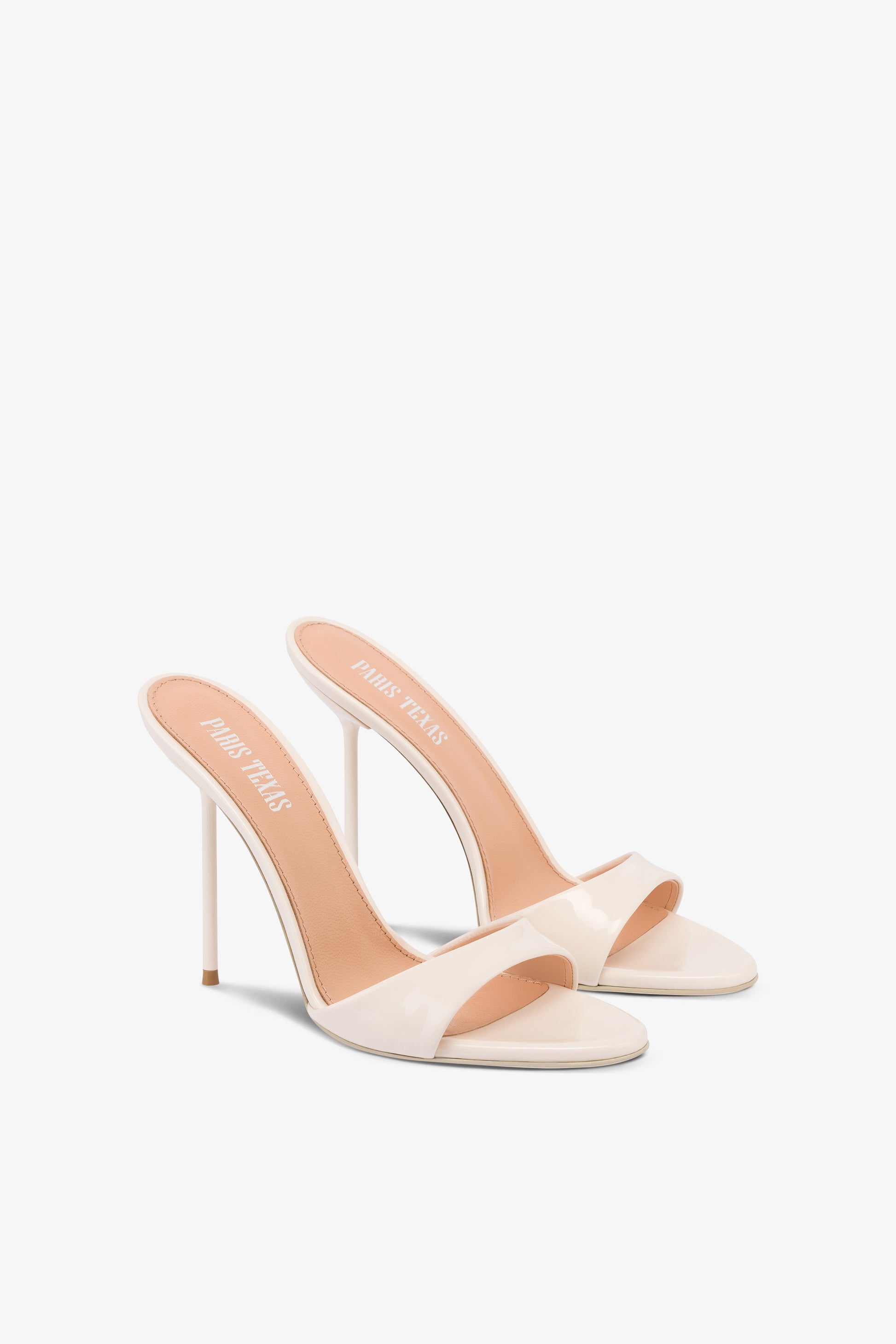 Mules in ivory patent leather