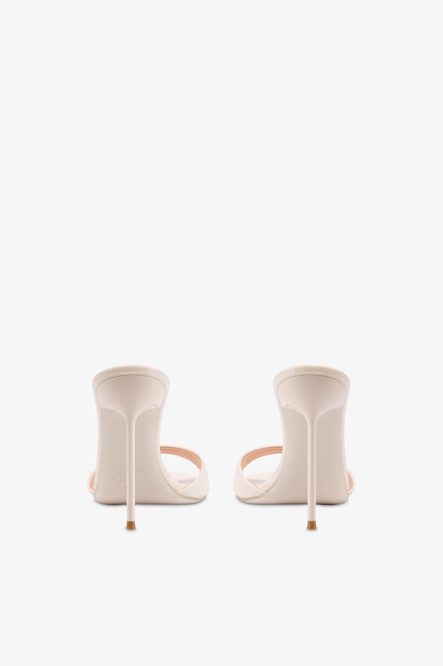 Mules in ivory patent leather