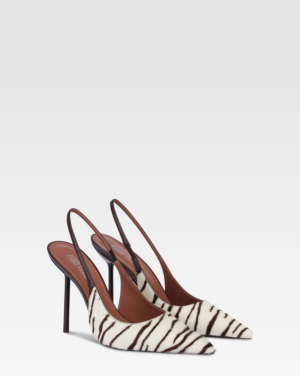 Slingbacks in white and ebony printed cowhide.