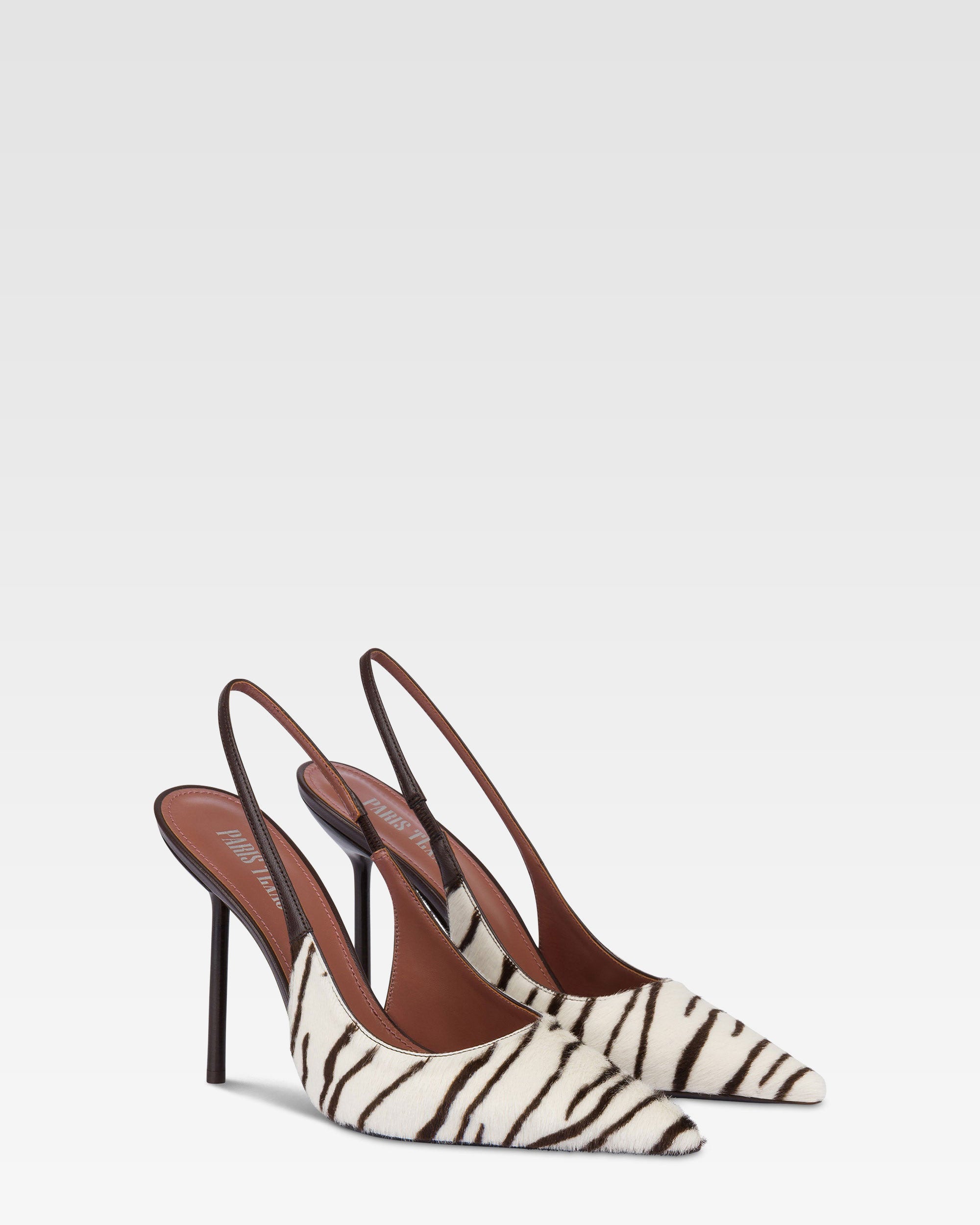 Slingbacks in white and ebony printed cowhide.