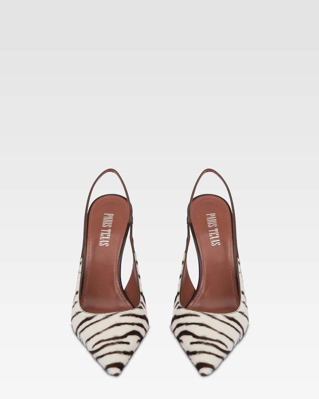 Slingbacks in white and ebony printed cowhide.