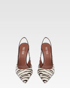 Slingbacks in white and ebony printed cowhide.